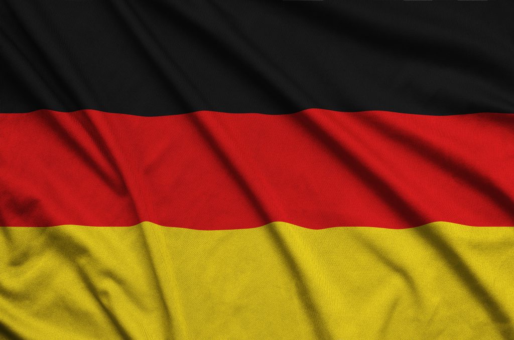 Germany flag  is depicted on a sports cloth fabric with many folds. Sport team waving banner