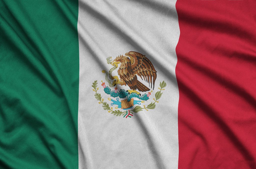 Mexico flag  is depicted on a sports cloth fabric with many folds. Sport team waving banner